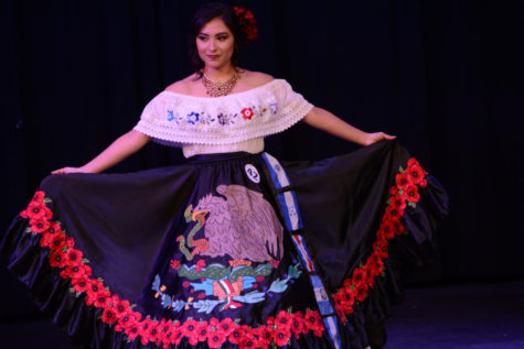Former Cinco De Mayo Queen, Amy Zeledon performs on stage.