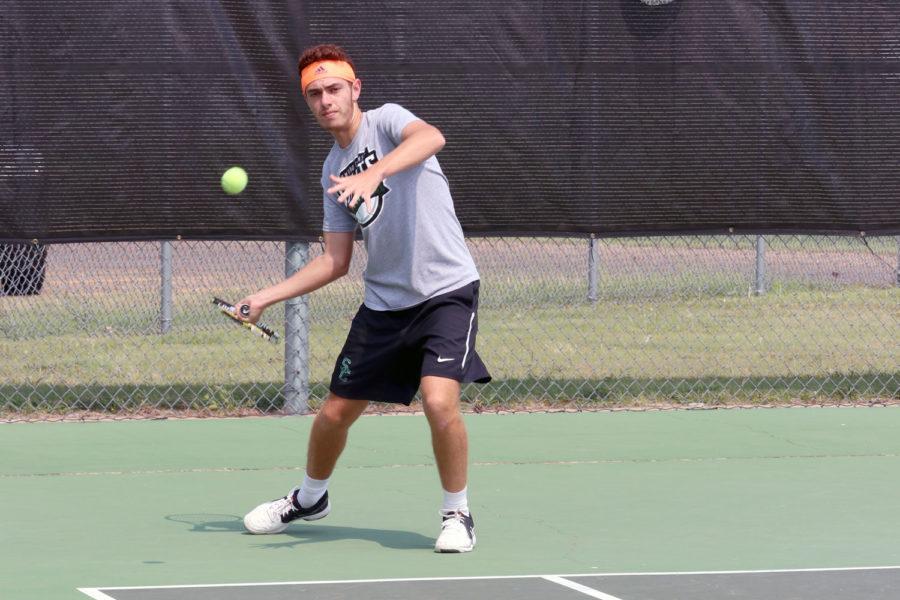 Sophomore Nicolas Rousset practices his return during pratice. (File Photo)