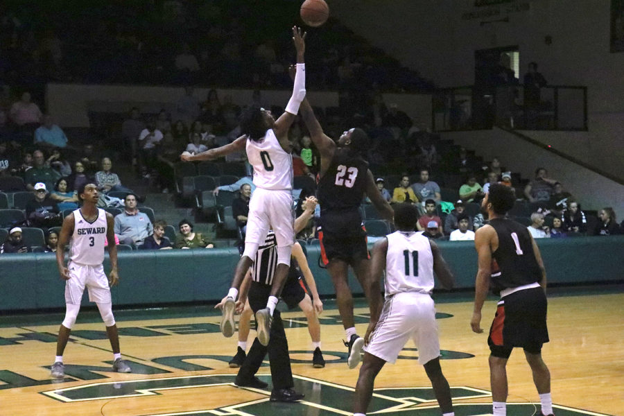 Sophomore guard, Isiah Small jumps for the ball during the tip-off of a game.