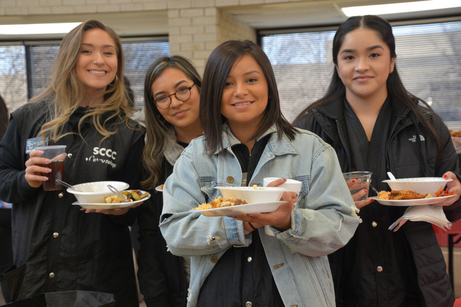 Cosmetology students, Paiton Bowers, Yajahira Munoz, Amy Trejo and Lupita Aguilar came to try out the different tastes of food that was provided for everyone at the SCCC library on Jan. 29. 
