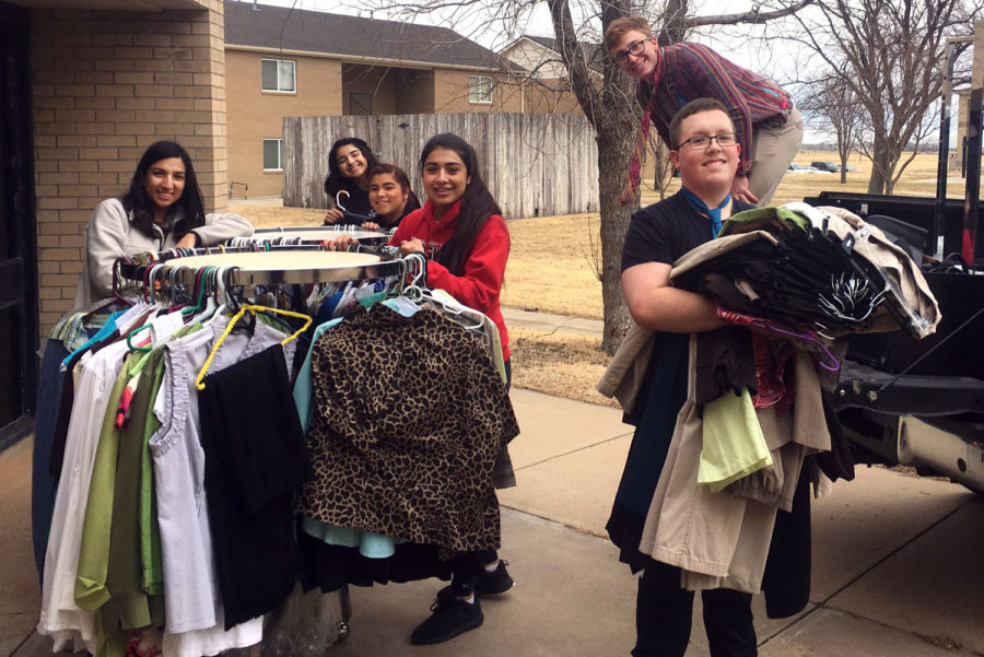 PBL members help set up the new boutique. This boutique will help women who are seeking employment by offering clothing and help for interviews.
