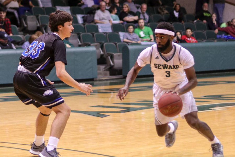 Sophomore guard Devin Bethely tries to get past Pratt Community Colleges Drew Honas on Feb 9. in the greenhouse. 