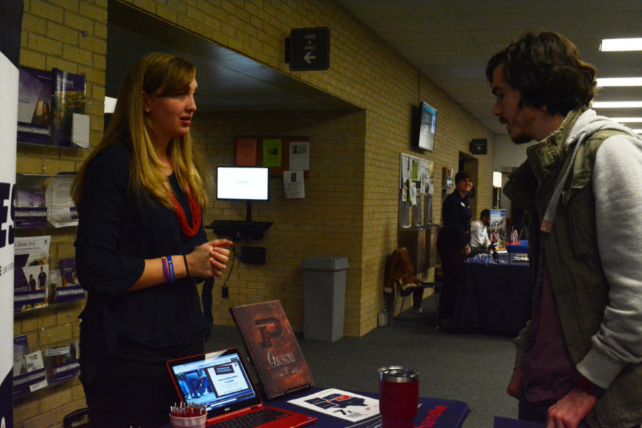 Chandler Harp talks to Oklahoma State Panhandle rep Hannah Hammock.