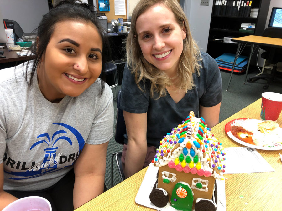 The winners of the Gingerbread House decorating contest are Monica Gonzalez and Amberley Taylor. The decorated houses went on display at the information desk.