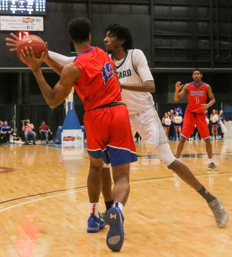 Good defense sparked the Saint’s offense all night. Isiah Small closes down the passing lane for Hutchinson with an outstretched arm. Small was productive for the Saints all tournament on the defensive and offensive end. He was named co-MVP of the tournament.
