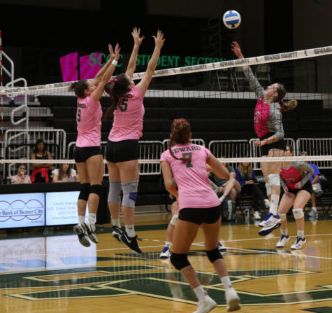 Sophomores Djuly Schmorantz and Thais Vieira deny the lady cougars a hit into their side of the court. Sophomore Laura De Pra recovers to help waiting for a sneaky tip.