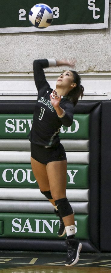Asia Jhun serves against Pratt Community College. The freshman from Hawaii normally plays the libero position for the Lady Saints.
