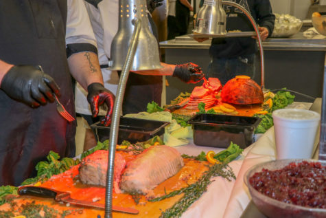 Freshly sliced ham and turkey were served during the free Thanksgiving lunch. Sides were also served such as mashed potatoes, corn, green bean casserole, sweet potatoes and bread rolls.