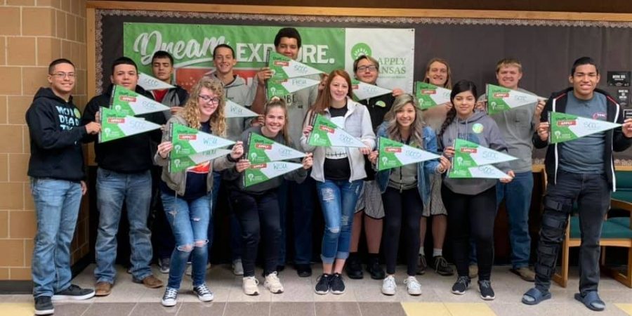 Satanta High School seniors show banners where they plan to attend college. The goal of USD 507 is that students will graduate with college or vocational credits.