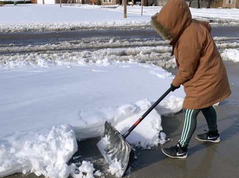 Sophomore journalism major Annette Meza decided to help and shovel the snow off her driveway. She said it was very tiring but building the snow man afterwards was fun!