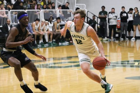 Kyle Cardaci drives to the basket. The sophomore guard is from Holmdel, New Jersey and helped lead the Saints to a 68-63 victory over Pratt Community College. The win was the third in a row for Seward and takes them to 4-5 in Jayhawk West Conference play.