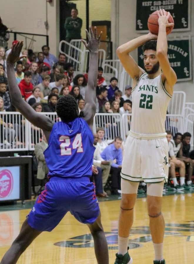 Ahmed Ibrhim stands tall over Hutchinson Community College player. Ibrhim takes him on without breaking a sweat.
