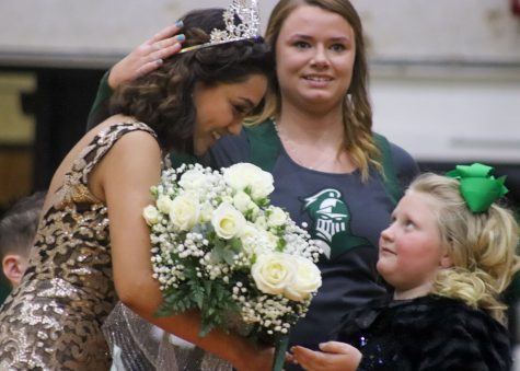 Cheerleader Alicyn Carey crowns fellow cheerleader Celia Gutierrez. Gutierrez said she was shocked and couldn't believe it!