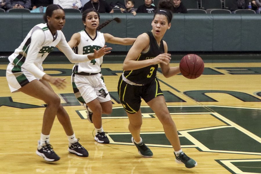 Ayanna Smith and Kamy Perez are on defense trying to get the ball back. (file photo)