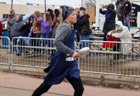 Whitney Hay placed first in the Liberal leg of the Pancake Day race, but lost to Olney, England by three seconds.