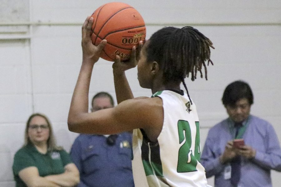    Wanda Cuamba (#24), sophomore at SCCC, gets ready to shoot her shot at the February 1 game. 
