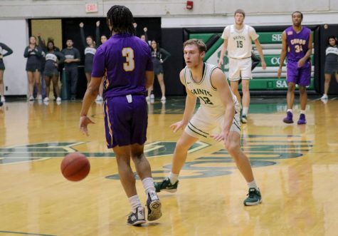 The Saints held a win last night against Dodge City Community College. Kyle Cardaci in defense against Kevin McGaskey.