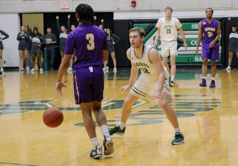 The Saints held a win last night against Dodge City Community College. Kyle Cardaci in defense against Kevin McGaskey. 