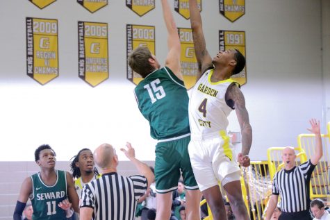 Rostyslav Novitskyi skies for the jump ball against Garden City’s Traylynn Spencer. Novitskyi helped in 6 rebounds last night against Garden City Community College.