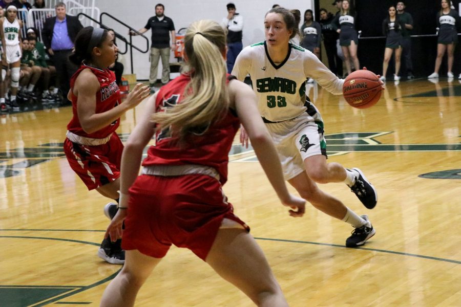 Karolina Szydlowska drives to the basket against Allen Community College. Szydlowska is a sophomore from Wroclaw, Poland. She scored nine points last night. The Lady Saints jumped out to an early lead in the first round of regional play.
