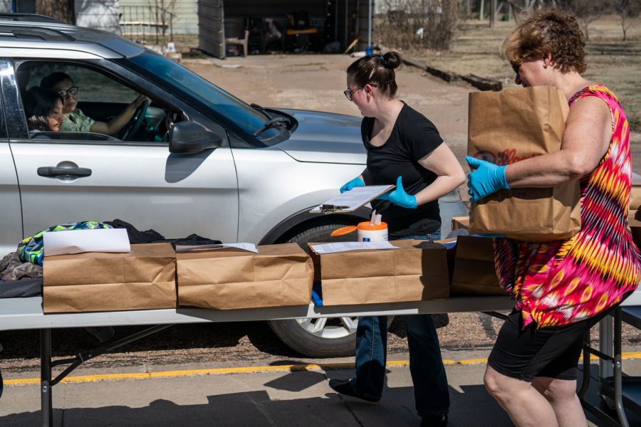 Satanta teachers worked hard to put student’s supplies in brown paper bags while wearing personal protective equipment to keep the community safe. This system was set up as a drive-thru so students could get their supplies quickly so the next could do the same. 