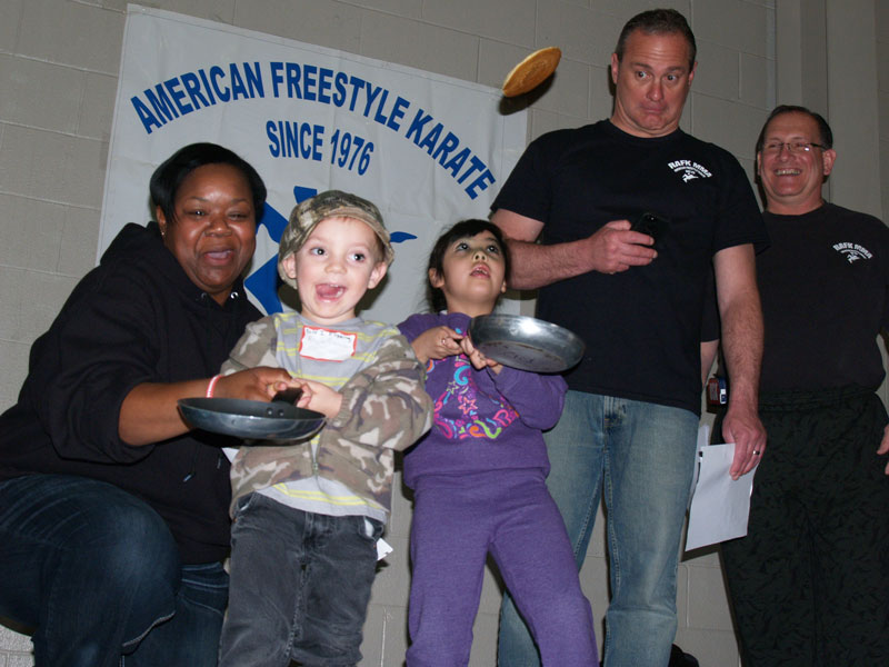 In years past, children flip pancakes as part of Liberals annual celebration. (File Photo)