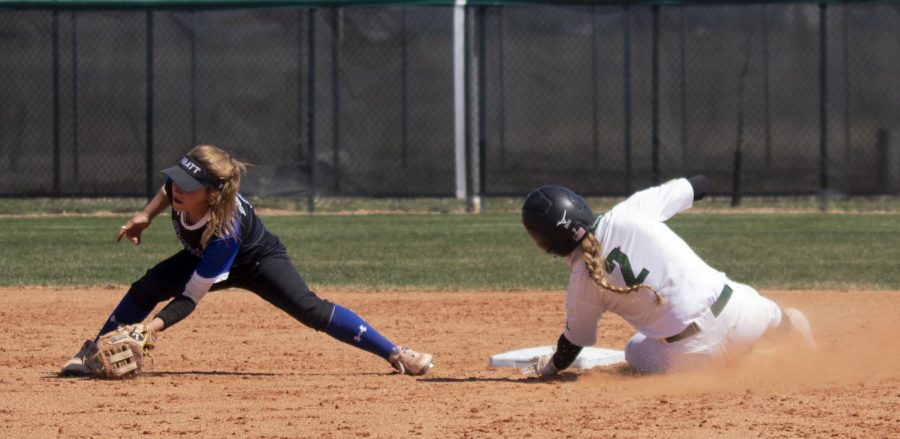 Jaci Oakley slides into second base and is called safe by the umpire. The Lady Saints won both games against Pratt Community College. 