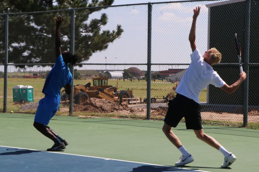 The mens tennis team practices serves. Theyve had a long break between their last match against Barton Community College on April 17 and heading to nationals this weekend. The monthlong break helped to heal injuries and get fresh legs.