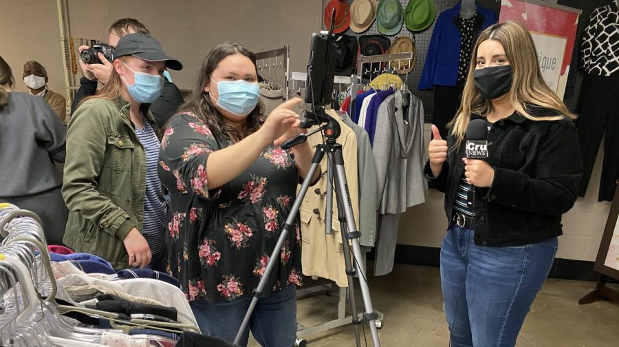 The Crusader staff works together to cover a story over the reopening of the E-boutique. The staff worked on shooting interviews with the members of the PBL club.  