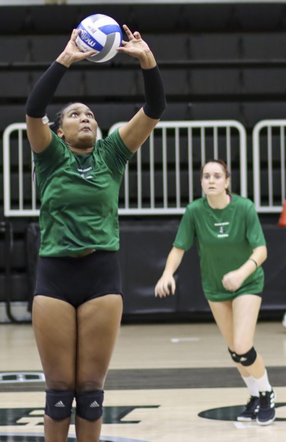 Ileim Terrero, sophomore from Santo Domingo, Dominican Republic, practices setting the ball while calling plays. The veteran setter scored 4.5 points on opening weekend at a tournament in New Mexico while logging more than 20 assists.