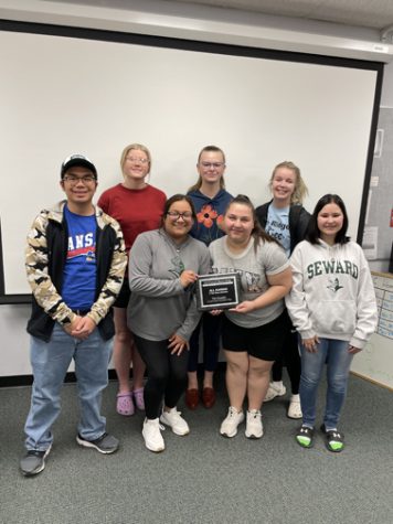 The Crusader News spring 2022 staff poses with the All-Kansas award. It is the fourth consecutive naming of SCCC for the top honor in the state for college media. The staff included Front Row: Melvin Lee, Jessica Madrigal, Dani Arellano, Brianna Rich. Back Row: Megan Berg, Laura Gillespie and Reece Hay. Not pictured: Ashanti Thompson.
