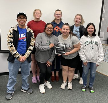 The Crusader News spring 2022 staff poses with the All-Kansas award. It is the fourth consecutive naming of SCCC for the top honor in the state for college media. The staff included Front Row: Melvin Lee, Jessica Madrigal, Dani Arellano, Brianna Rich. Back Row: Megan Berg, Laura Gillespie and Reece Hay. Not pictured: Ashanti Thompson.