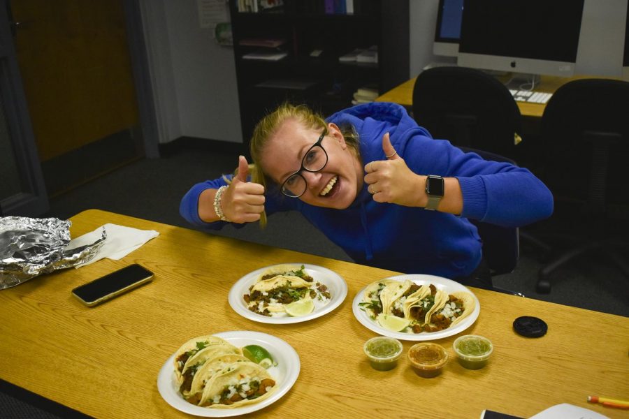 Saskia Vogelzang, super sophomore from The Netherlands, digs into a plate of tacos. She had never been to a taco truck before the class assignment.