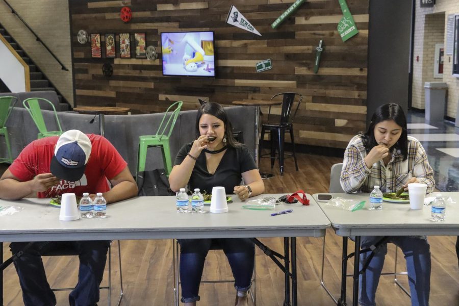 When the competition starts, the room falls silent. Brianna Domingues, Lupita Ugalde and Kris Cruz quickly stuff their mouth with a jalapeno rushing for a chance to win the big prize of $100. 