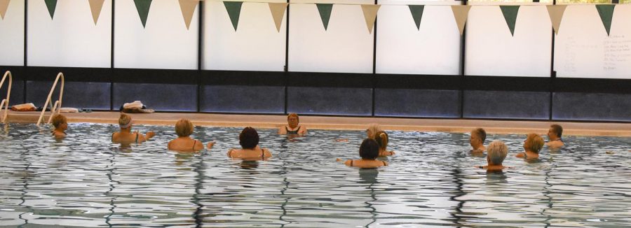 The class follows the movements of instructor Barres. They were doing arm exercises in the Seward pool.