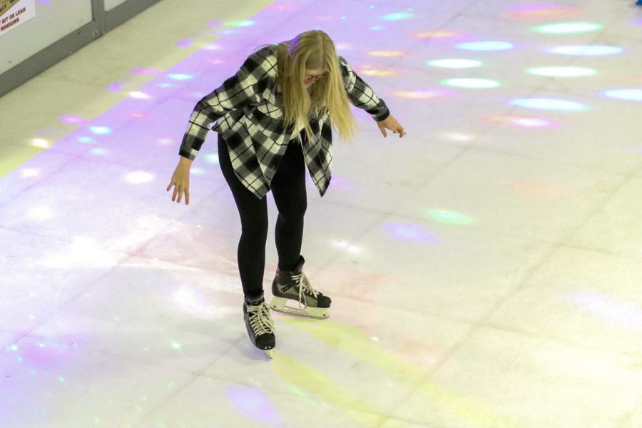 Megan Berg, a business major from Sublette, catches herself after trying to twirl on the ‘ice’ in the student union. She only made it about halfway around before she almost fell and caught herself. 