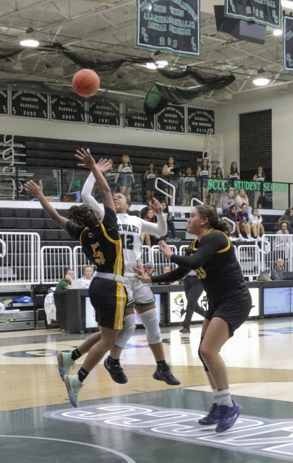 D’Arrah Allen up for a layup while being blocked by Roxi Cox and Kay Hauata Phillips. Allen had an overall of 27 points and she plays as point guard for the Lady Saints