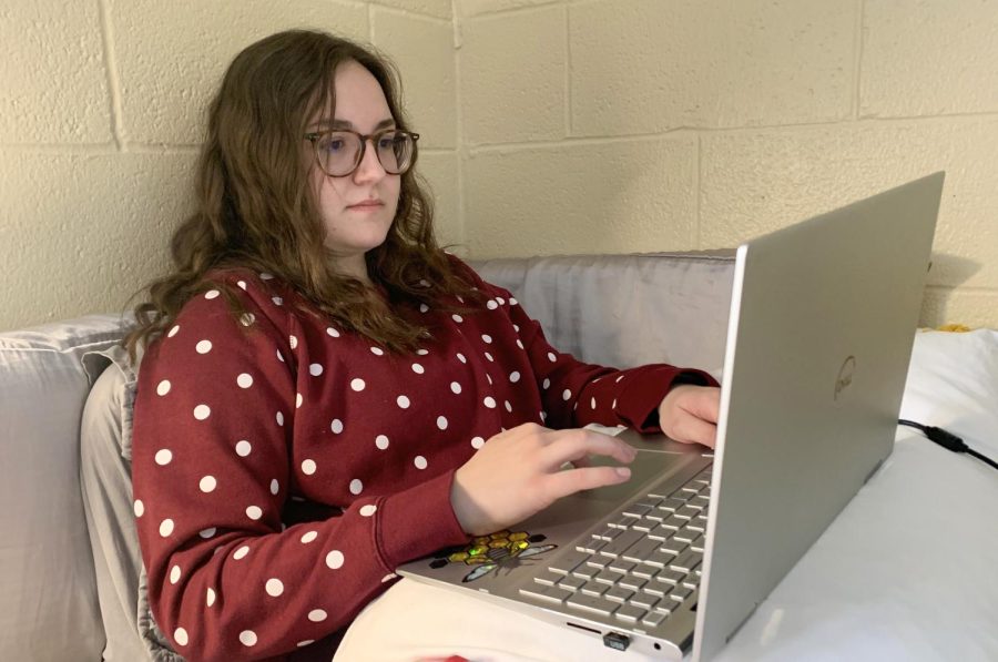 Katie Culwell logs into class via zoom from her bed. The business major still had classes despite campus being closed due to snow.