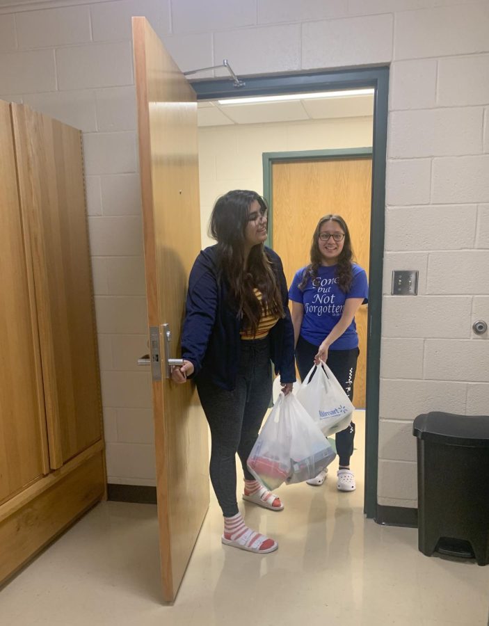 Jessica Martinez and Karina Rodriguez, both business majors, braved the grocery store on Tuesday night before the storm hit. They wanted to get snacks so they wouldnt have to walk outside to the cafeteria in the cold, snow.