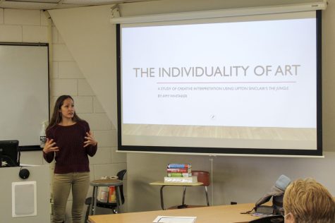 Amy Whitaker, a behavioral science major from Liberal, presents her slideshow on a study of creative interpretation using “The Jungle” by Upton Sinclair. The presentation was a final assignment for American Literature II. The presentation included different paintings based on jungles and different insights from Whitaker on the book. 
