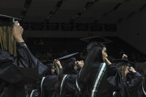  Students lift their tassels bringing them over to the left side of their cap signaling their official graduation. Crossing from left to right is a symbol of crossing one’s heart as Donovan explains.