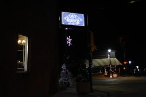 Tucked away on the side of Kansas Ave is a locally owned coffee shop with a sit-in service. Outside of Cozy Corner, many Christmas decorations fill the street and light up the entrance to this shop. 