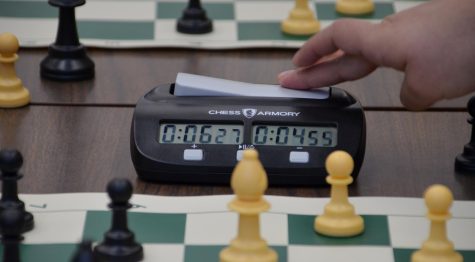 Players not only have to move chess pieces, but they also have to keep track of their time. They do this through the chess clock which keeps track of their time and makes sure that neither player overly delays the game.