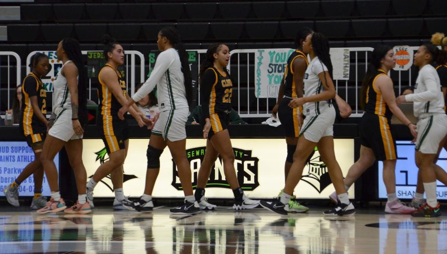 Telling each other good game is the Lady Saints and the Lady Thunderbirds. The result of the game was a win for the Lady Saints with the final score being 77-49.
