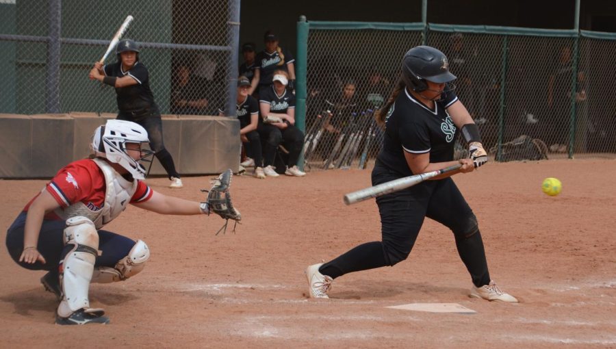 Fixing to collide with the ball is first baseman Samantha Gomez, a freshman from Albuquerque, New Mexico. In the first game Gomez received a run she batted in by bringing in Aaliyah Gutierrez.