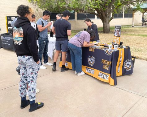 Seward County Community College students lining up to listen to what Fort Hays State University has to offer. Some FHSU staff also helped SCCC students start applying for FHSU.