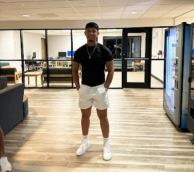 Isaac Canelon takes a break from playing UNO in the Student Living Center. Canelon also plays baseball for Seward County Community College and works as a personal trainer.  