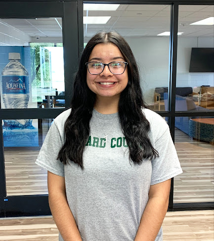 Jennifer Lopez smiles wide when posing for a photo after reading for art appreciation class. Besides studying,, Lopez also works as an RA.