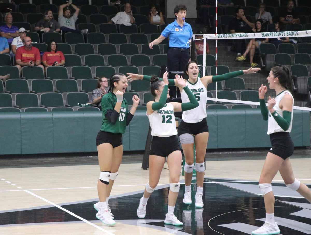 The Lady Saints celebrate after scoring a point. Alogether, the team holds 601 kills and 1984 attacks. 
