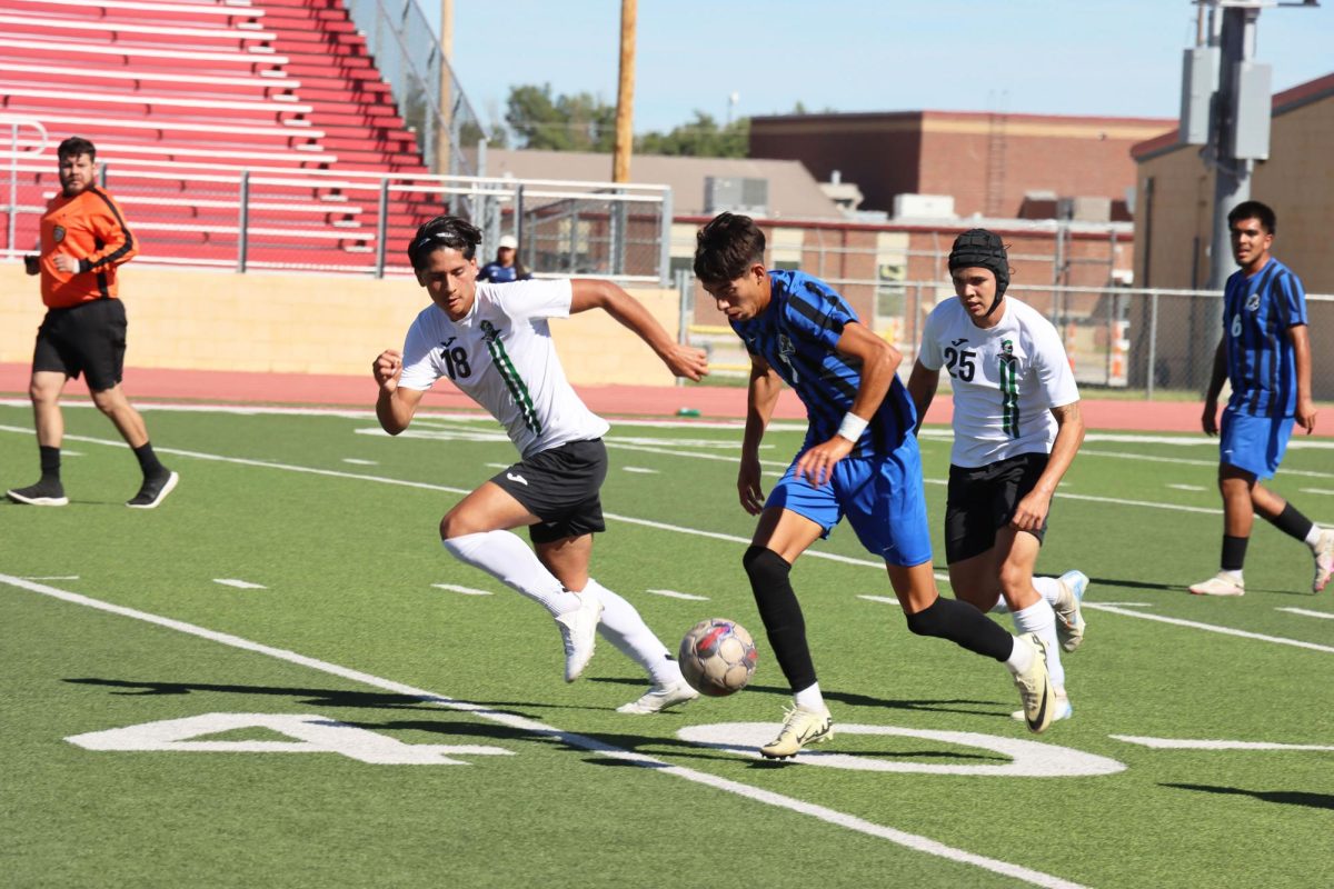 Defender Francisco Nava Gomez and midfielder Fernando Moura Filho attempt to steal the ball from Lamar player #7. Gomez assisted the third goal with a successful pass to Haynes.